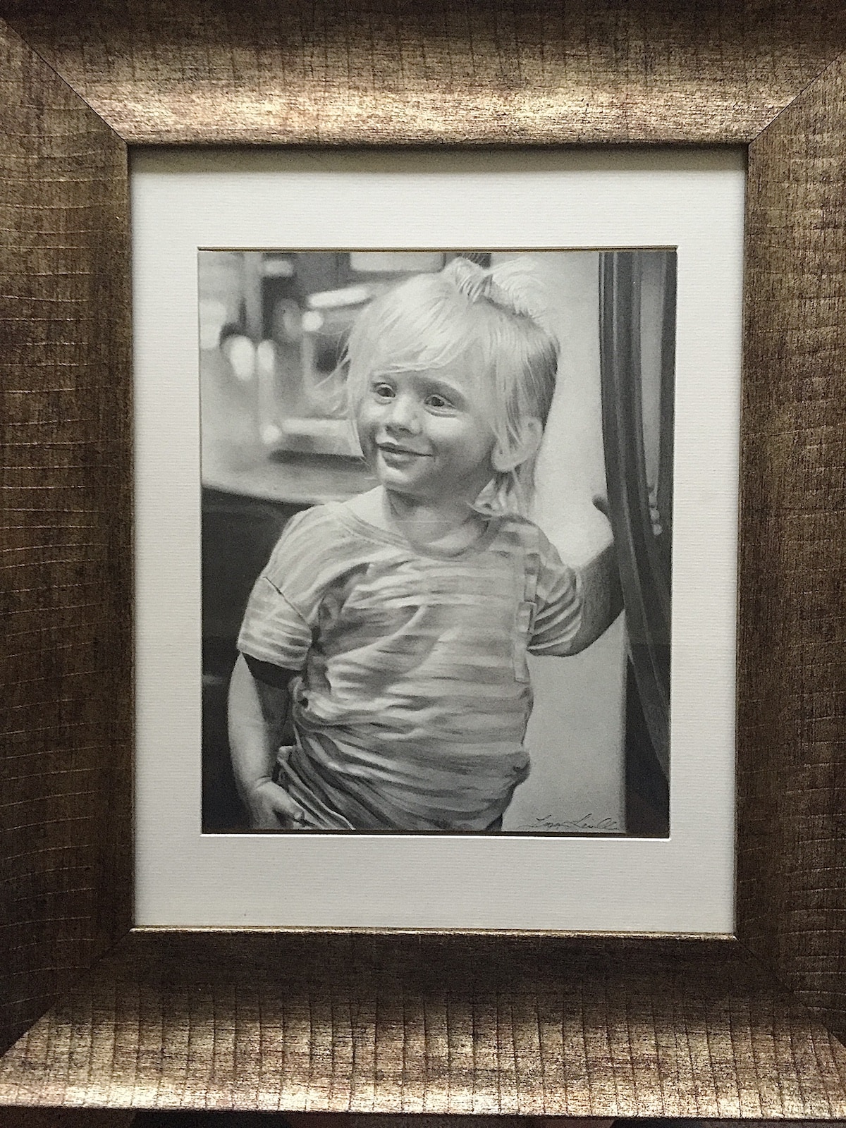 Smiling child, framed graphite