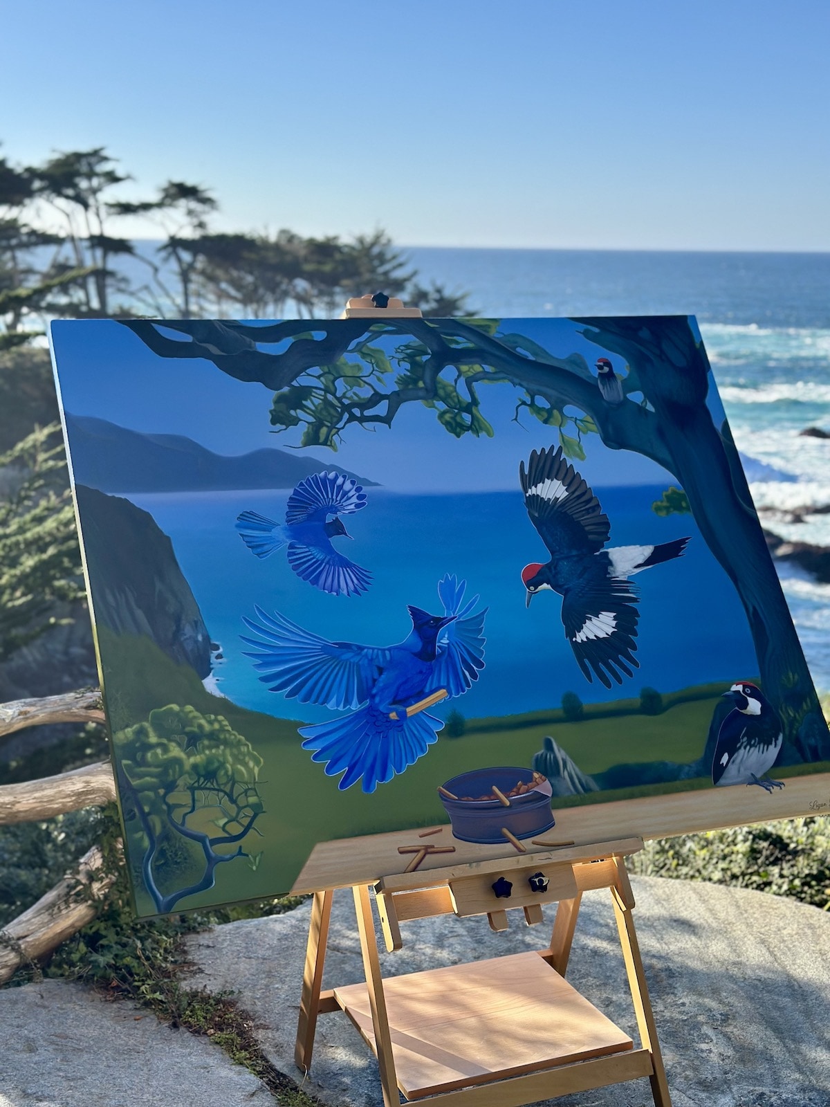 Blue jays over coastline, easel